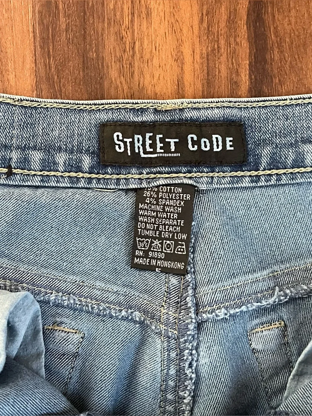 Vintage Y2K Street Code jeans with distressed star patch details